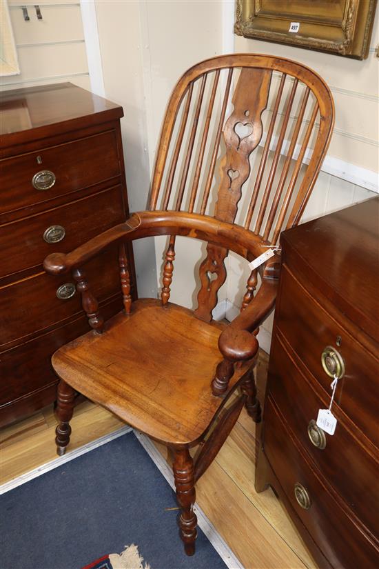 A harlequin set of six Victorian heart motif yew and elm Windsor chairs